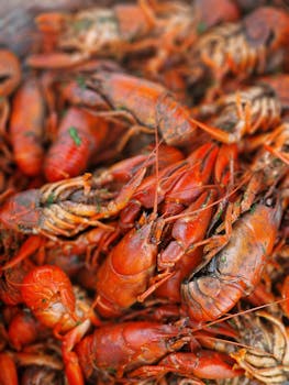 Close-up of freshly boiled spicy crawfish, showcasing vibrant colors and textures.