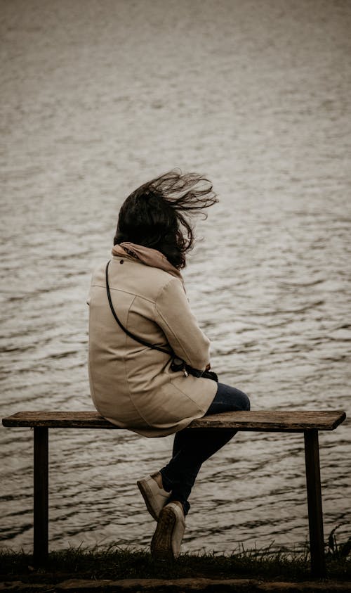 Photo of Woman sitting on a Bench