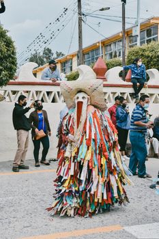 Colorful festival costume in Oaxaca, Mexico, capturing traditional culture and festive atmosphere.