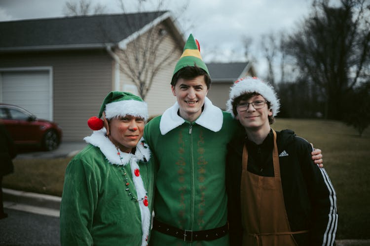 Group Of Young Men In Christmas Costumes 