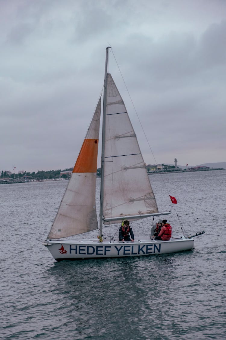 People Riding White Boat On Sea