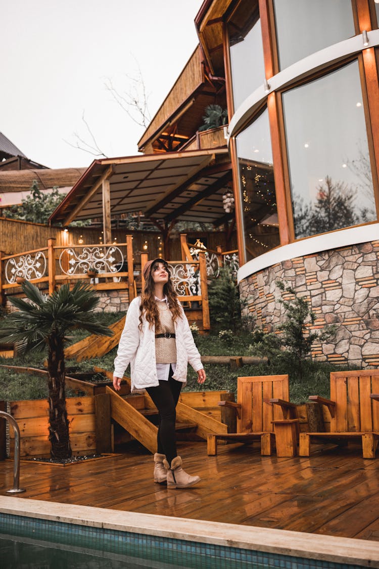 Woman Walking On Hotel Terrace