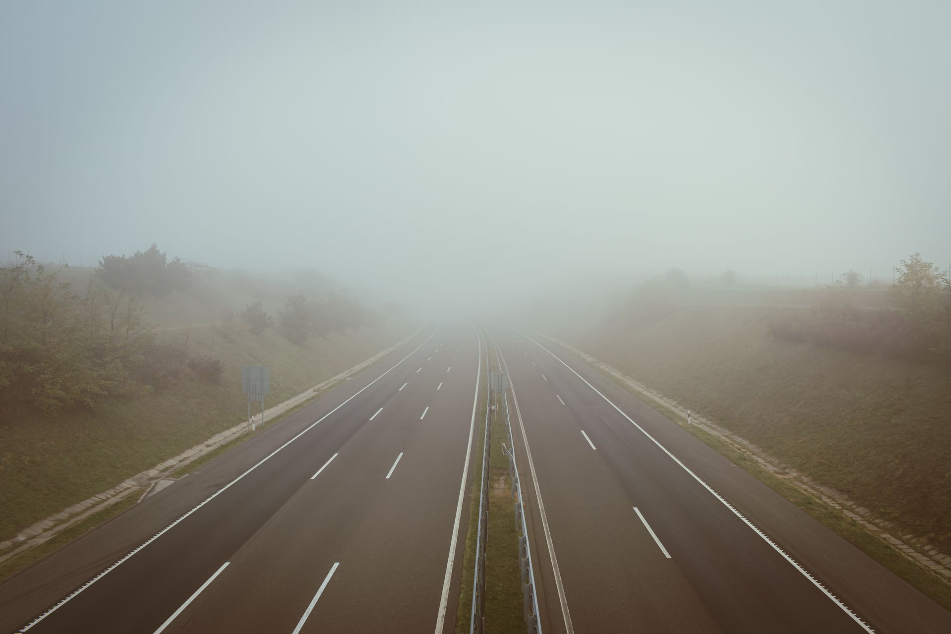 An empty highway on an overcast morning