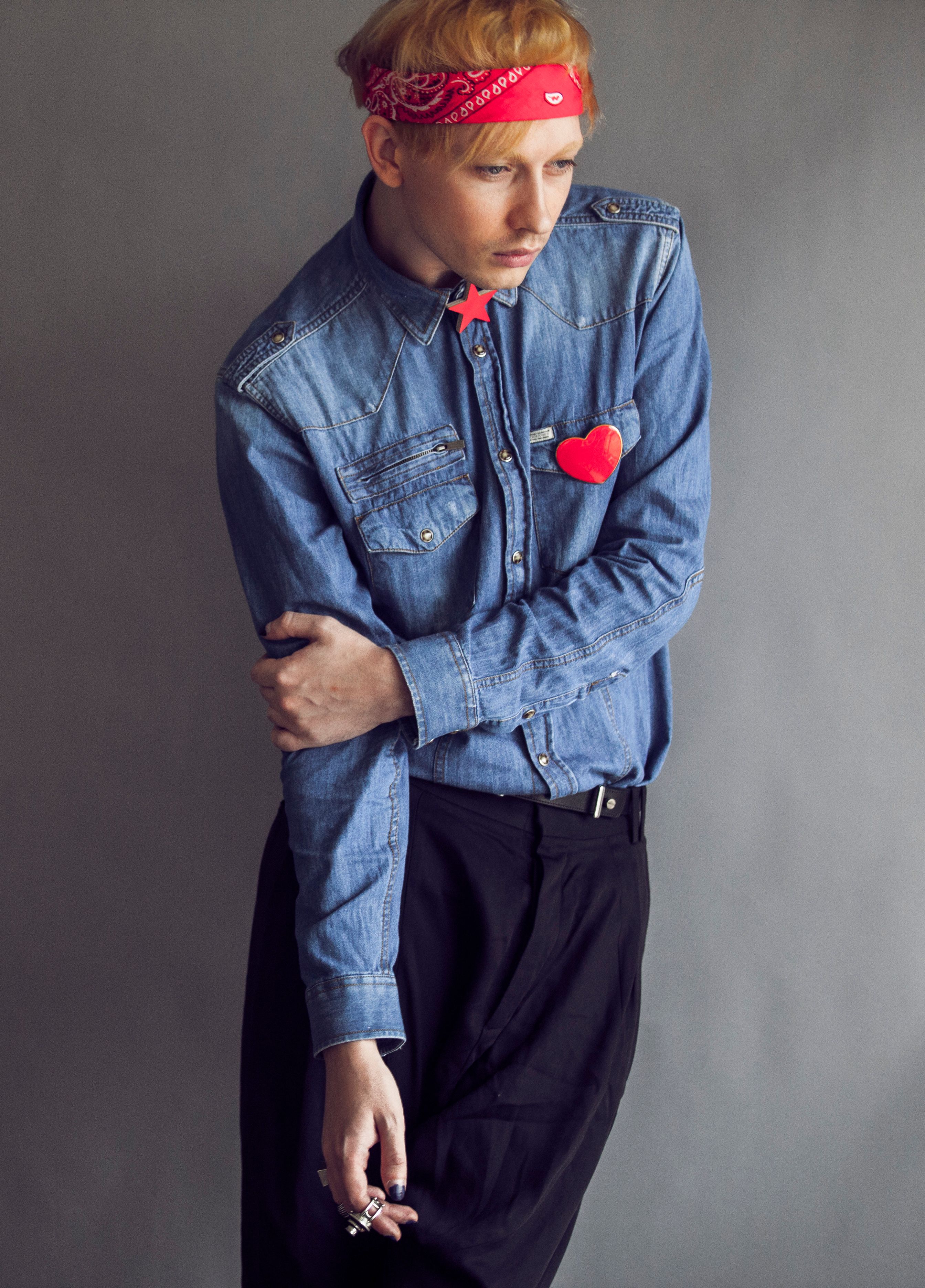 Stylish portrait of a man in denim and red bandana, showcasing modern fashion.