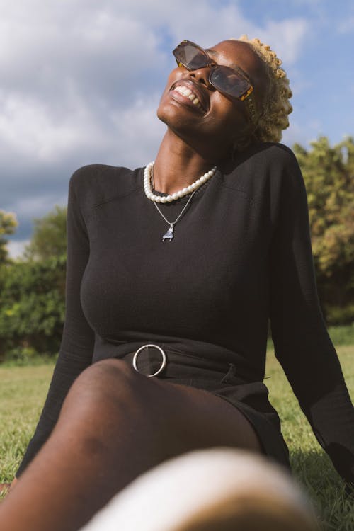 A Woman with Black Sunglasses Smiling