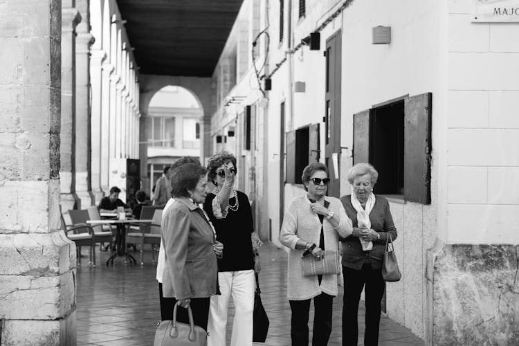 Four Women Standing On Hallway