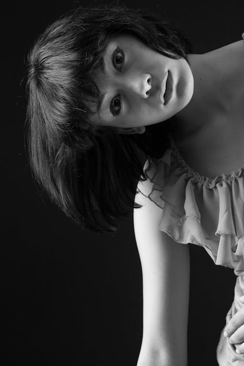 Grayscale Photo of Woman Wearing Cap-sleeved Top