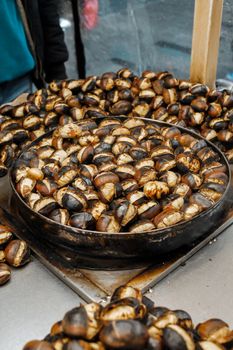 Savory roasted chestnuts at a street food stall in Istanbul, Turkey.