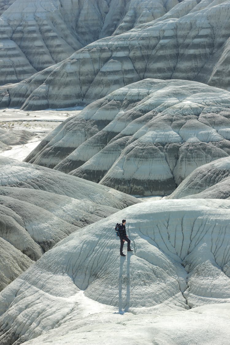 A Man Hiking With A Backpack