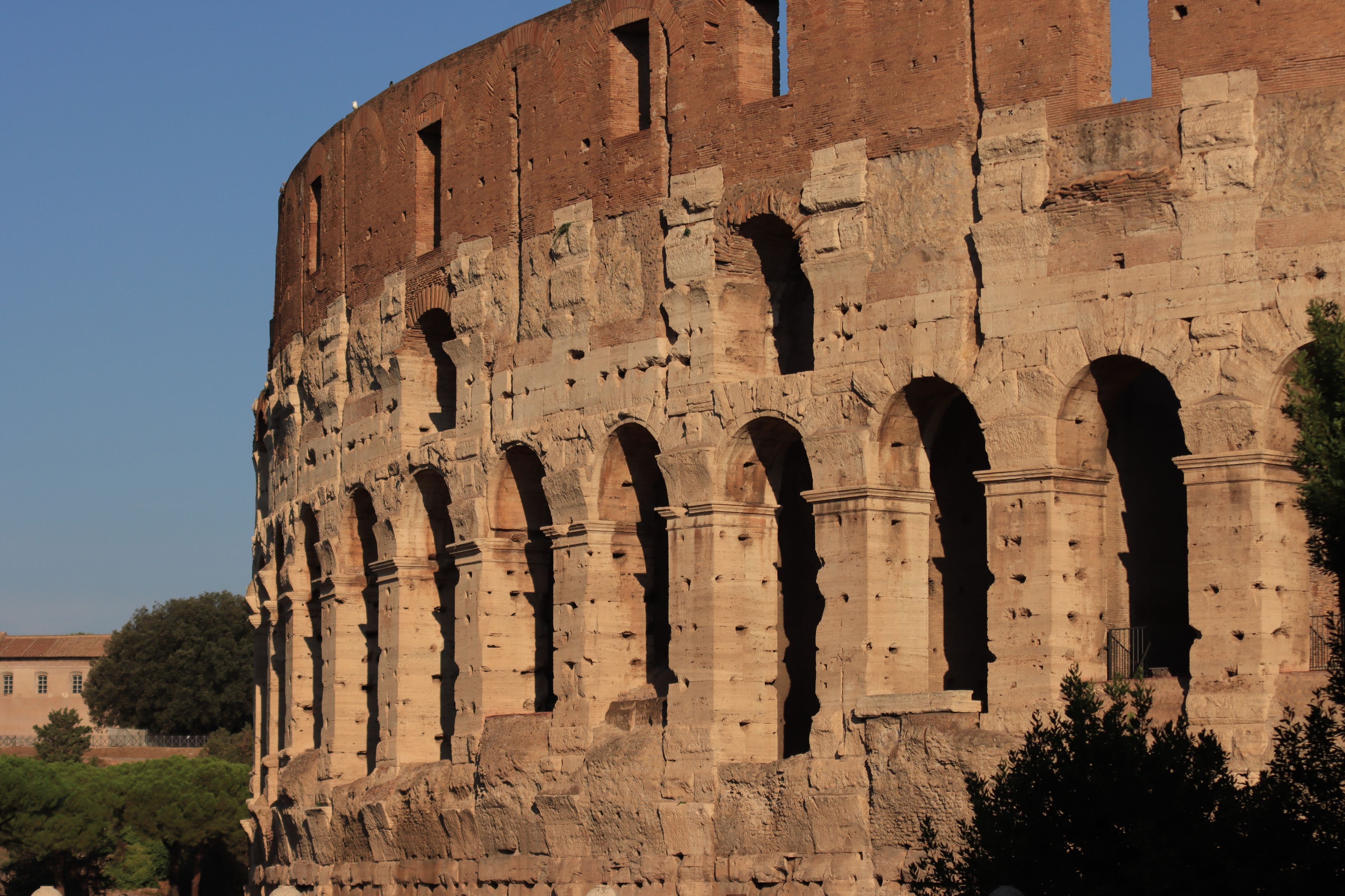 Close-up view of the iconic Colosseum in Rome, highlighting ancient Roman architecture.
