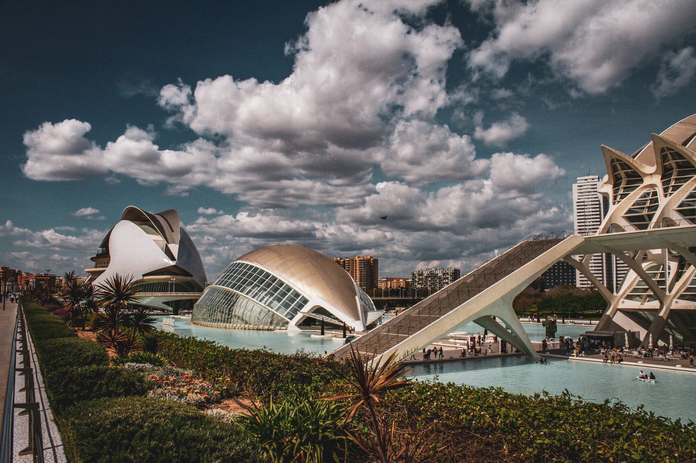 The City of Arts and Sciences in Valencia, Spain, reflected in its pools under a cloudy sky