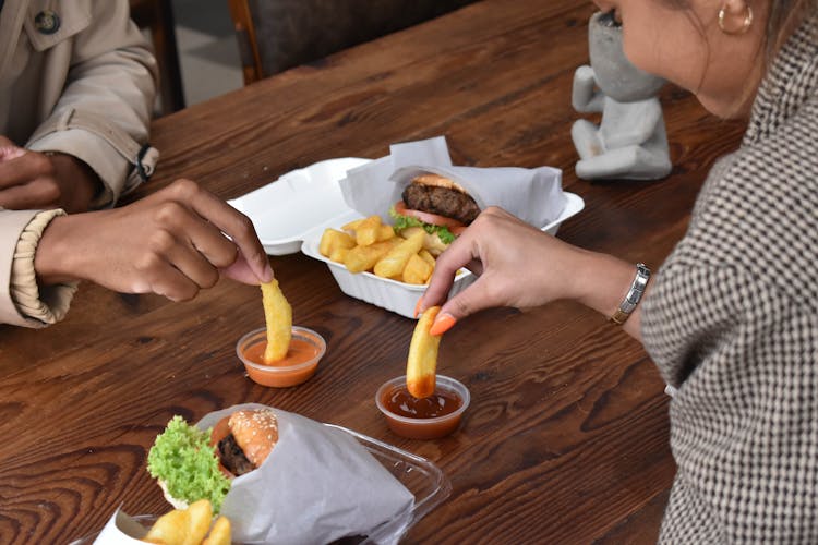 Dipping French Fries In Catsup