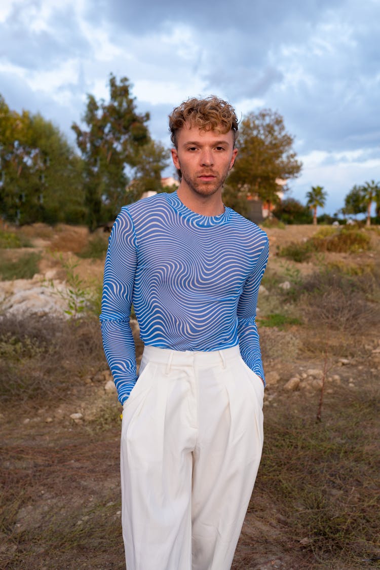 Man In Tight Shirt And White Pants 