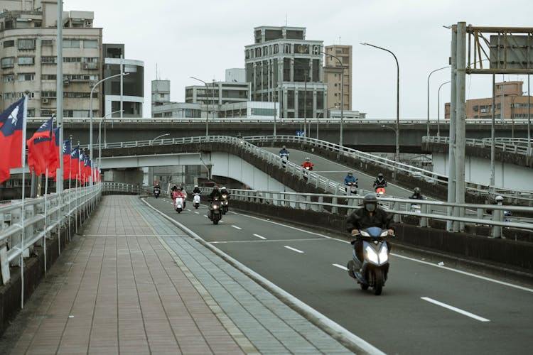 Scooters Driving On The Road