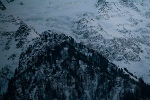 Stunning view of snow-covered mountains in Chamonix-Mont-Blanc, France, exemplifying winter's beauty.