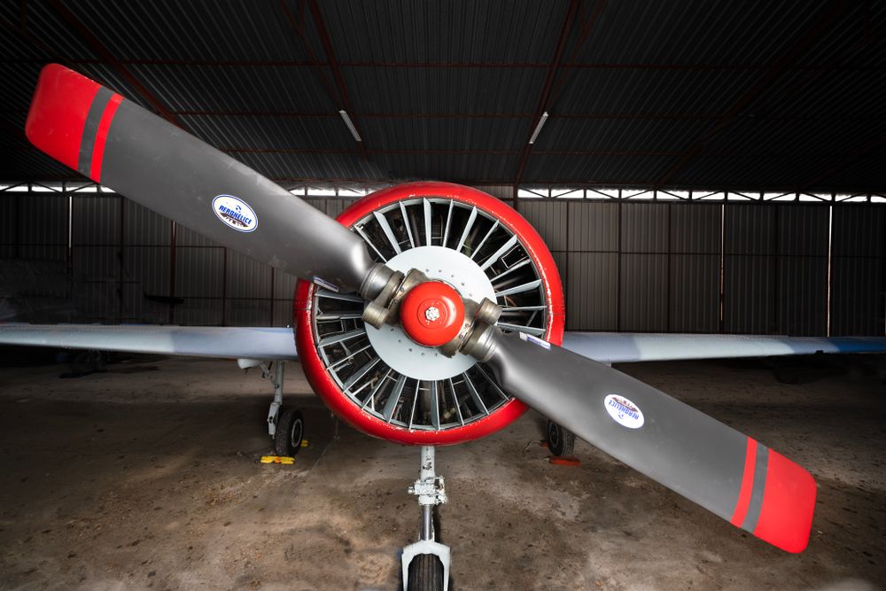 Close-up of a classic red propeller aircraft
