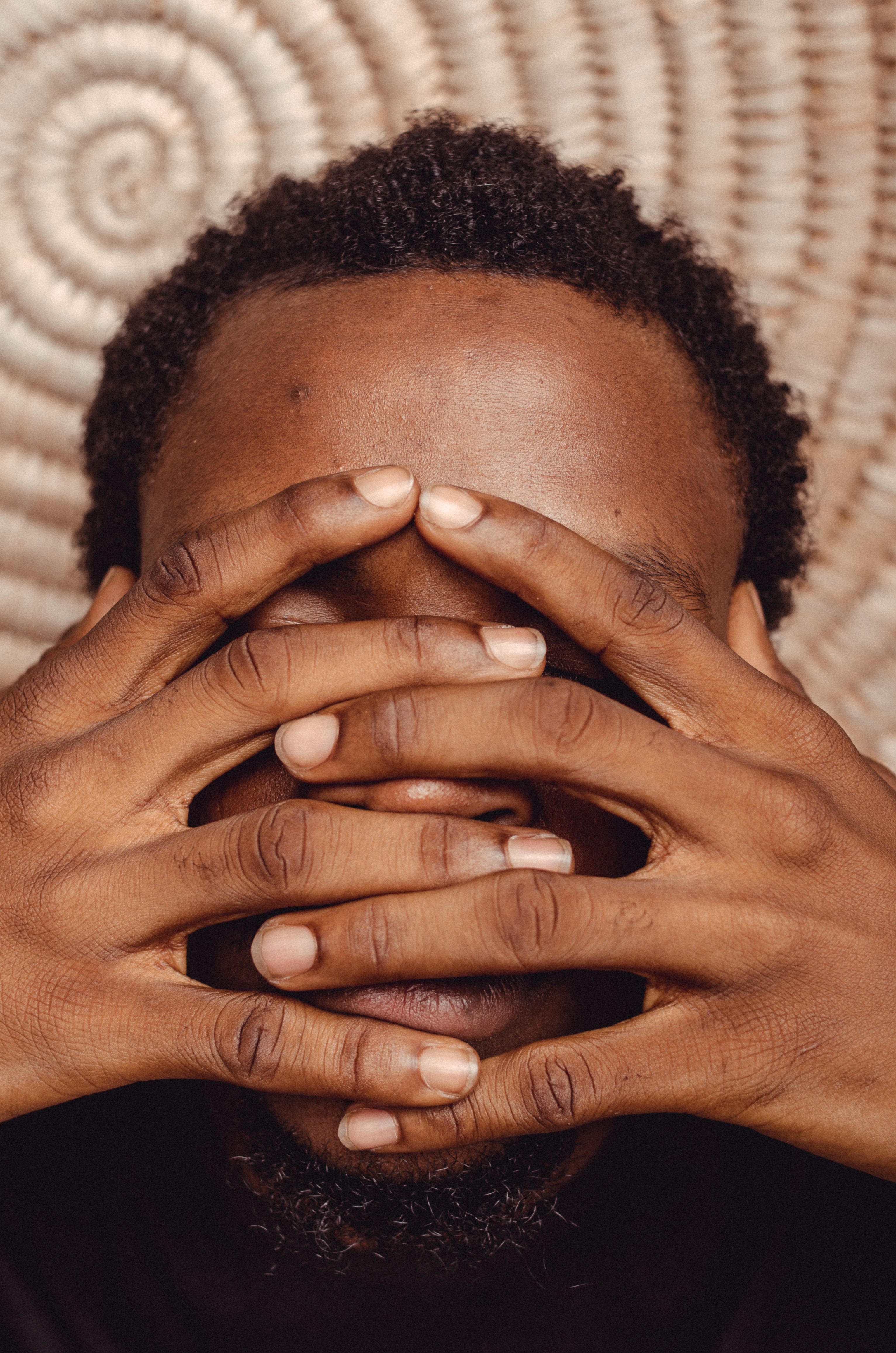 Close-Up Photo of a Man Covering His Face with His Hand with Rings ...