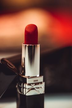 Close-up of red lipstick showcasing luxurious cosmetic design.