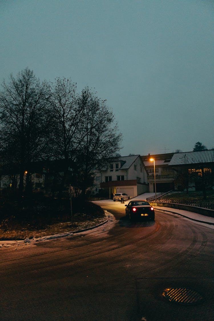 Car Driving On The Street At Night