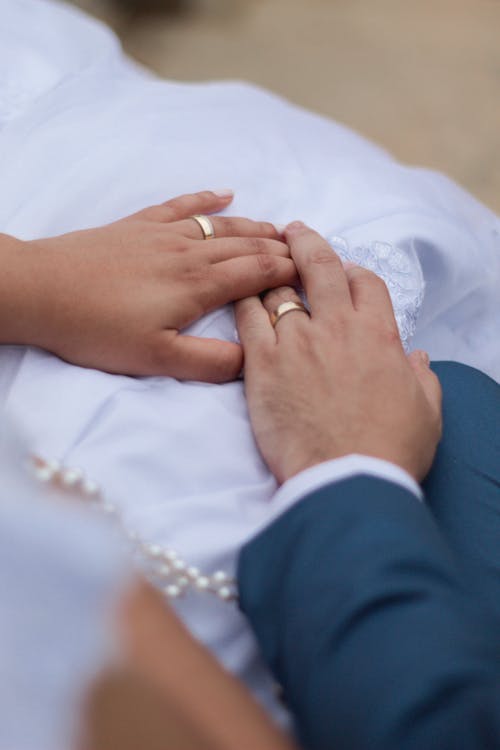 Close up of Newlyweds Holding Hands