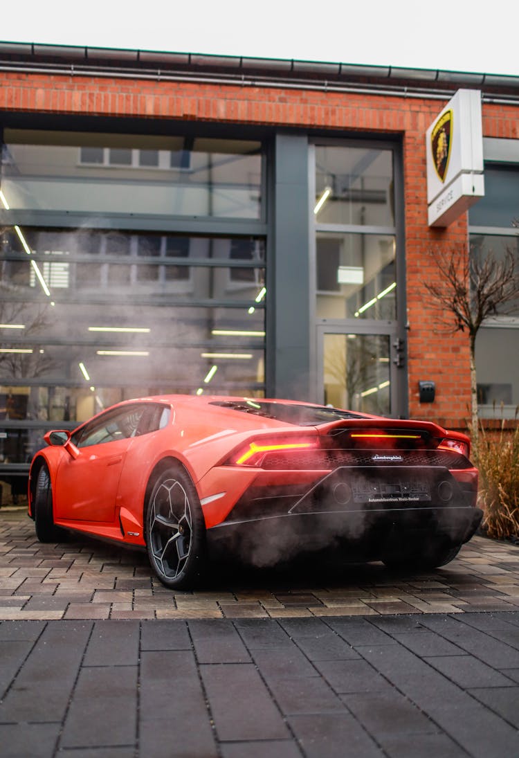 Red Lamborghini Parked On Pavement