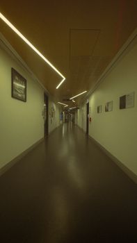 A serene and modern corridor with ambient lighting and framed pictures on the walls.