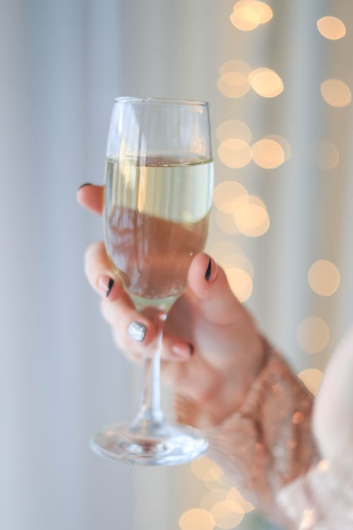 Woman Holding Glass with Champagne