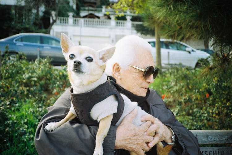 Elderly Man Carrying His Pet