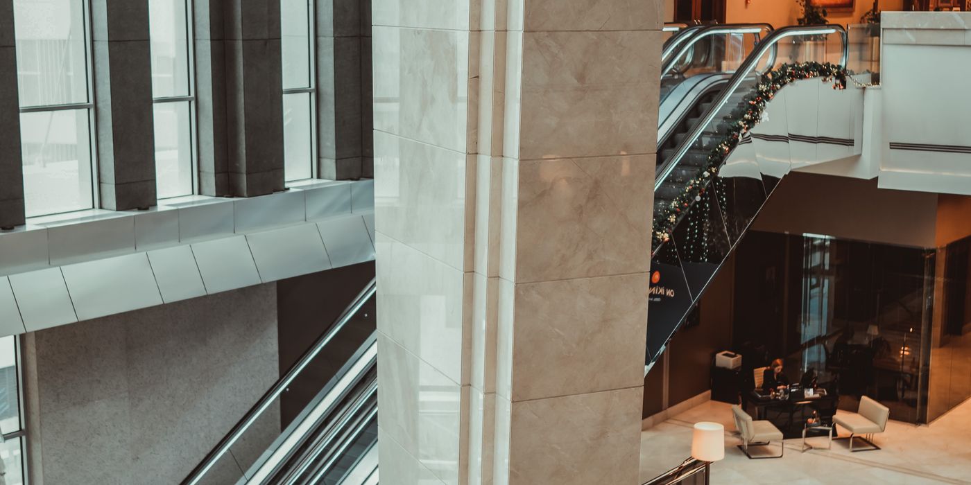Elegant luxury hotel lobby with marble floors and warm lighting