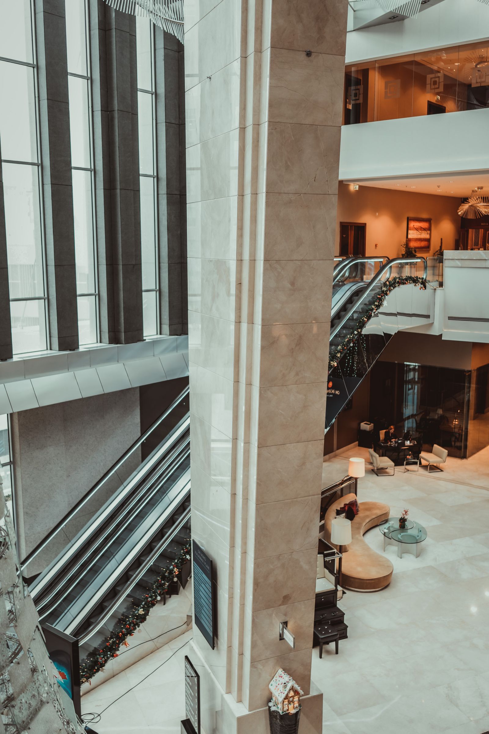 Luxury hotel lobby with warm lighting and a grand staircase, representing World of Hyatt award redemptions
