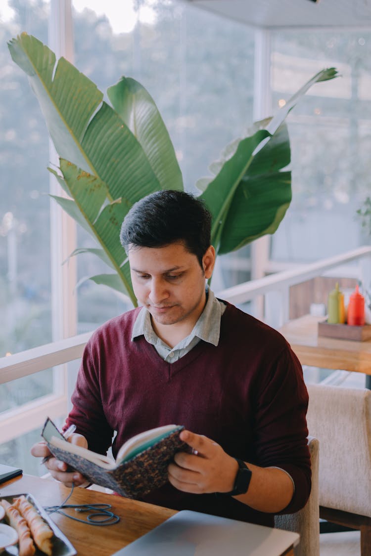 Man Sitting And Reading