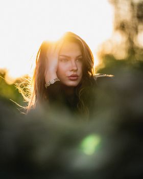 Stunning portrait of a woman in golden hour lighting, creating a serene and warm atmosphere.. stunning, portrait, woman