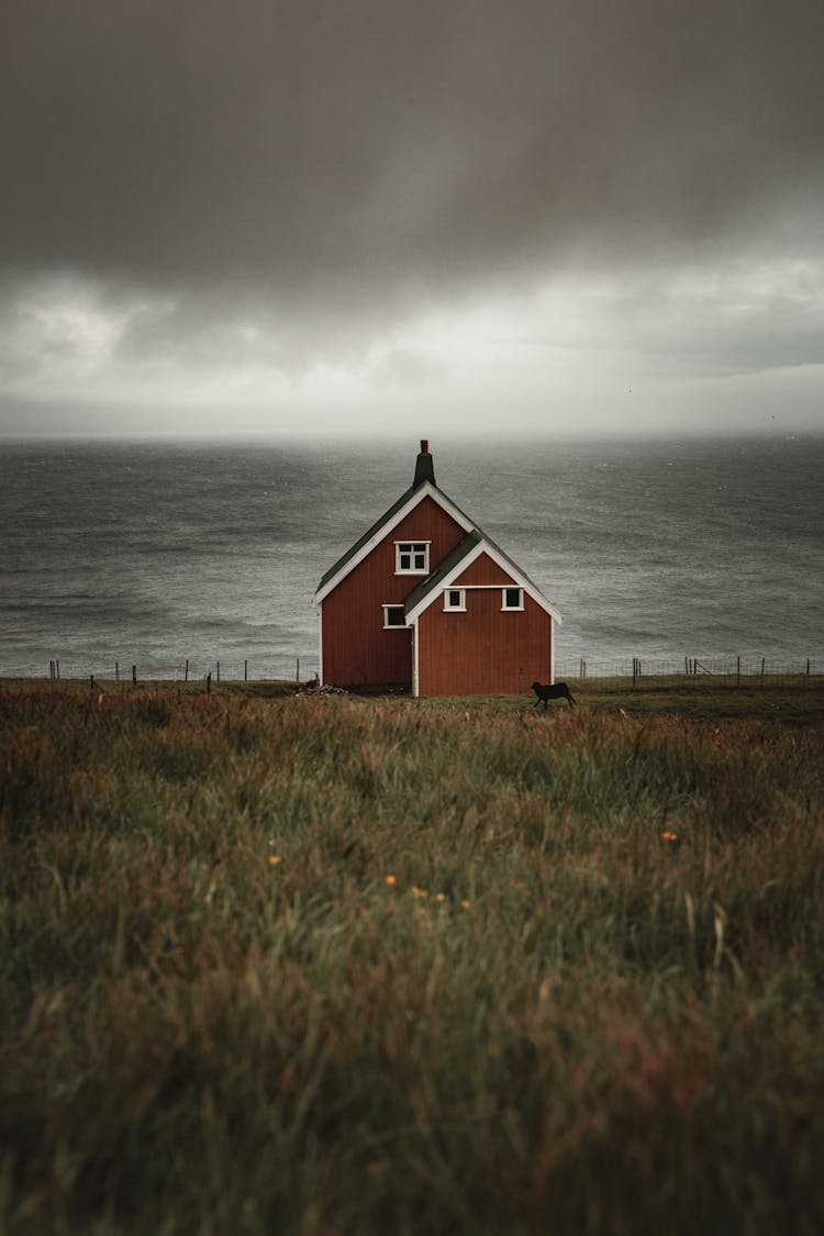 Wooden House On Seashore Near Sea