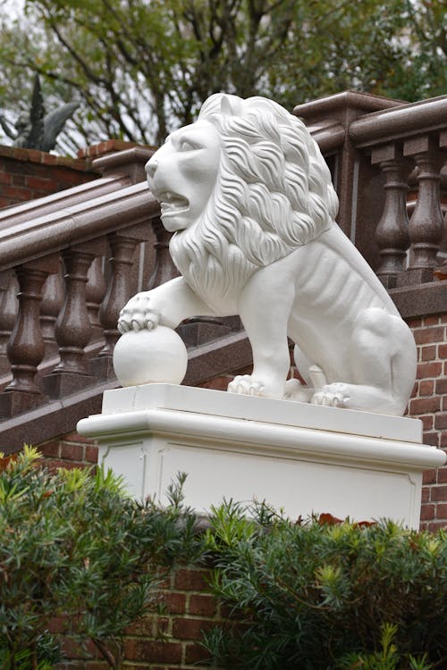 Sculpture of Lion near Stairs Railing