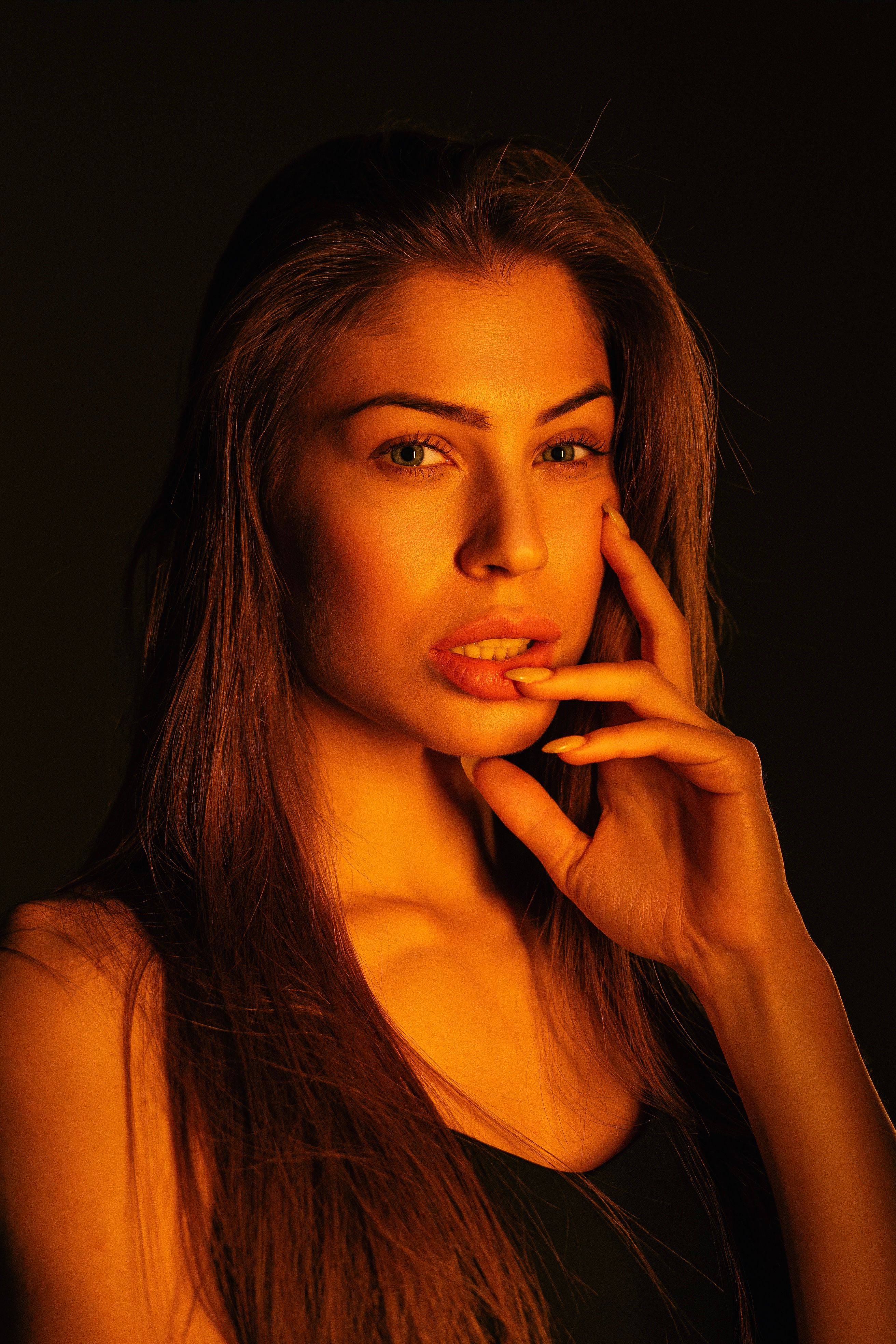 Stunning portrait of a woman with long hair, showcasing elegance and fashion.