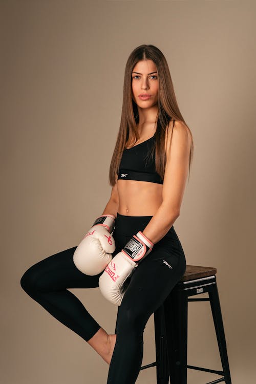 Portrait of Beautiful Woman with Boxing Gloves