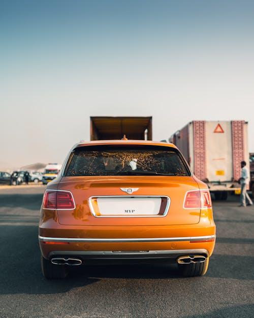 Back of a Bentley Bentayga on a Parking Lot
