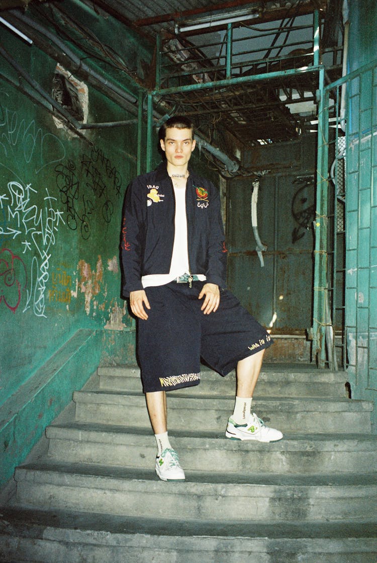 Photo Of A Man Standing On The Stairs In Industry Ambient