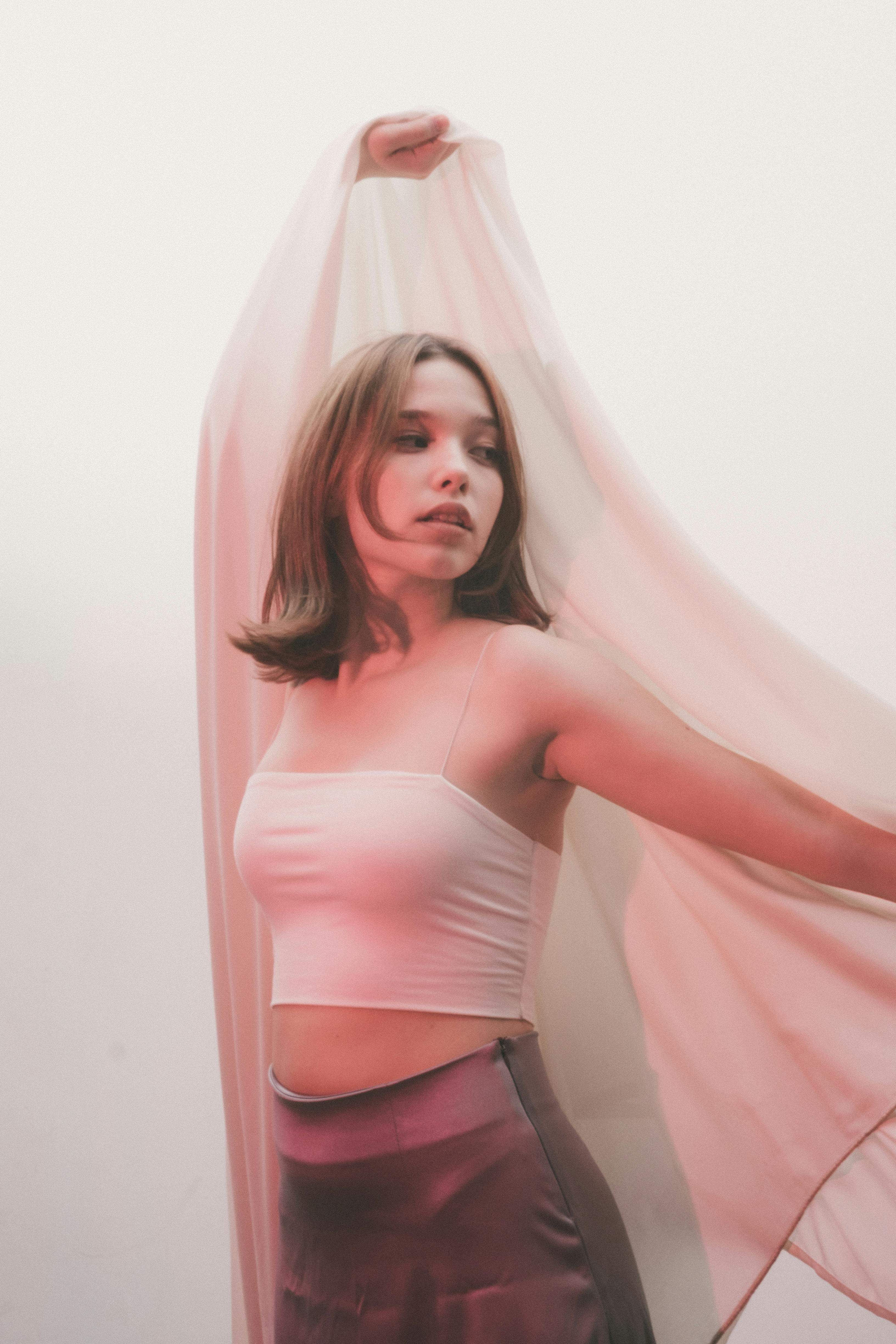 photo of a young woman wearing white tube top