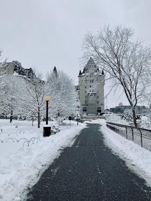 Asphalt Road to a Castle Surrounded with Snow