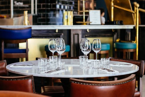 Free Photo of Different Empty Glasses on Table Stock Photo