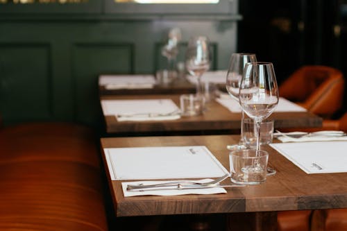 Free Clear Long-stemmed Wine Glass on Brown Table Stock Photo