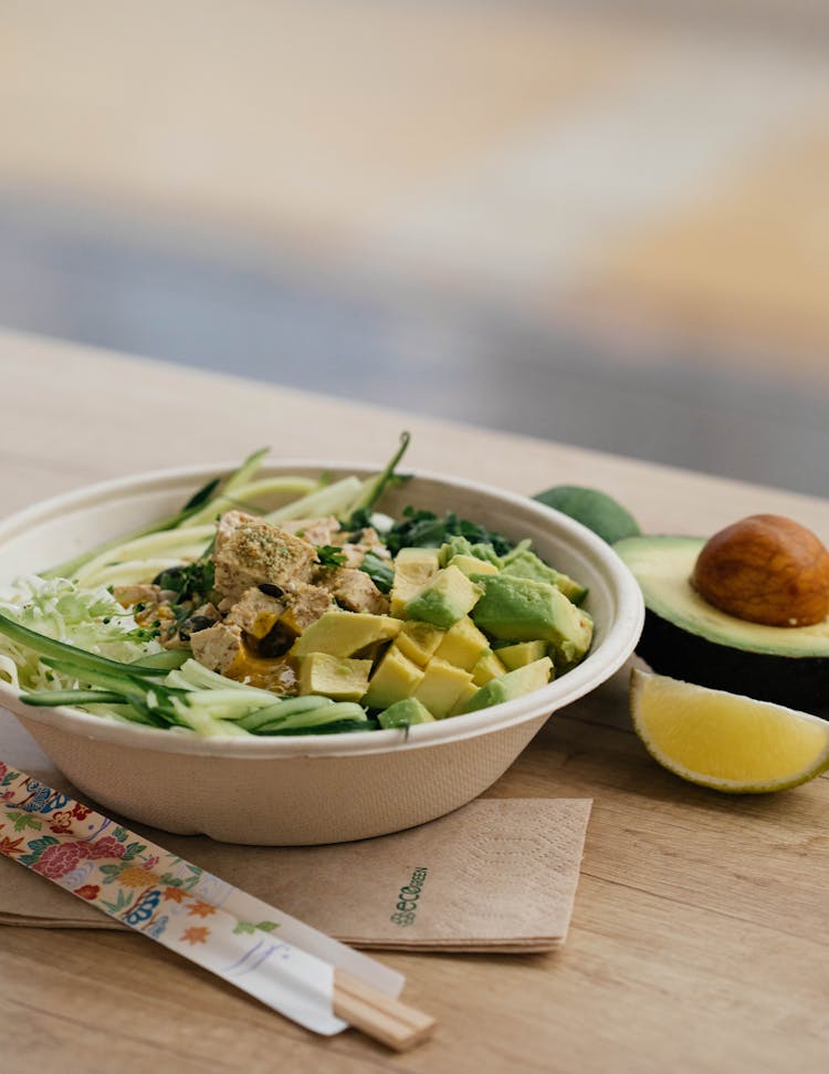 Salad With Sliced Avocado In Bowl