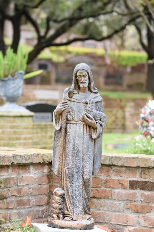 A Jesus Figurine on a Cemetery 