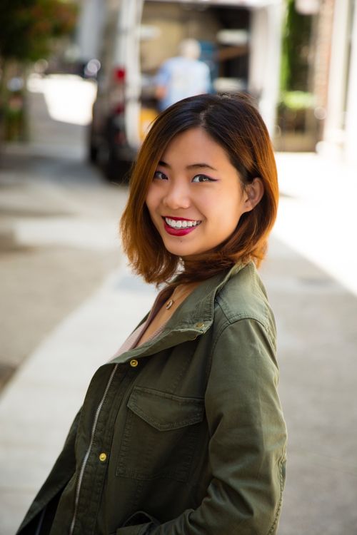 Free Smiling woman with short hair in San Francisco street, casual and engaging. Stock Photo