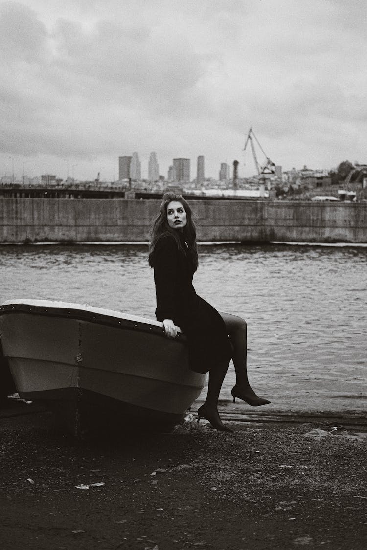 Woman Posing On Boat In City