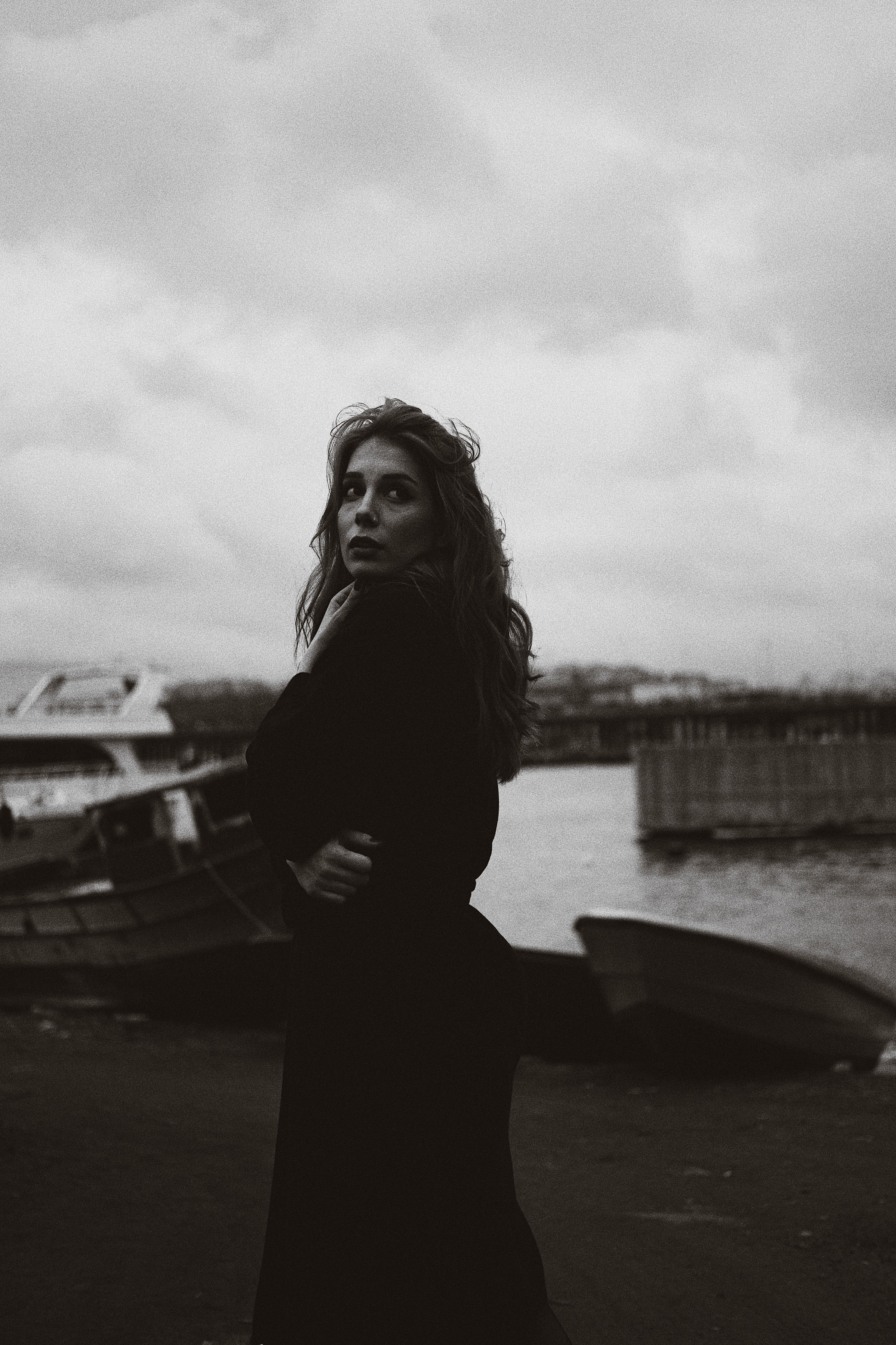 Grayscale Photo of a Woman in a Black Dress · Free Stock Photo