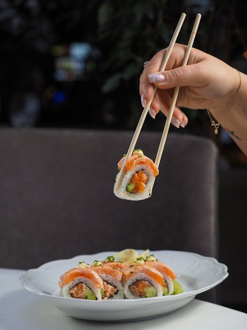 Person Eating Sushi