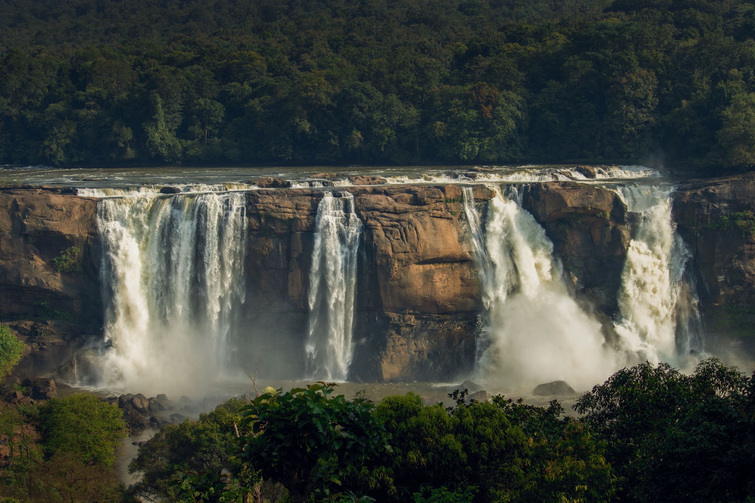 Monsoon waterfall thundering through the Kerala rainforest