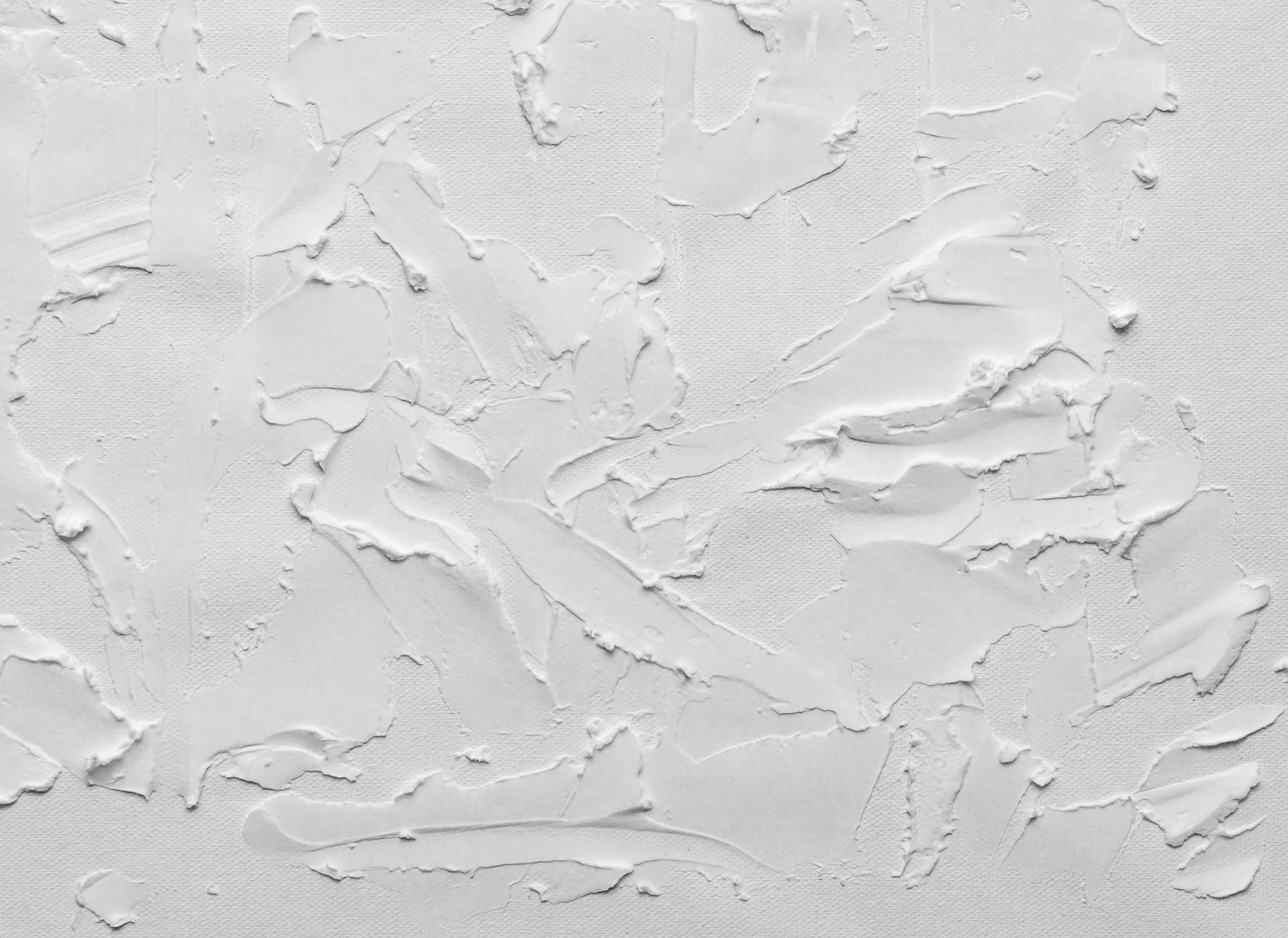 Close-up of a minimalist white textured background with abstract patterns, ideal for artistic compositions.